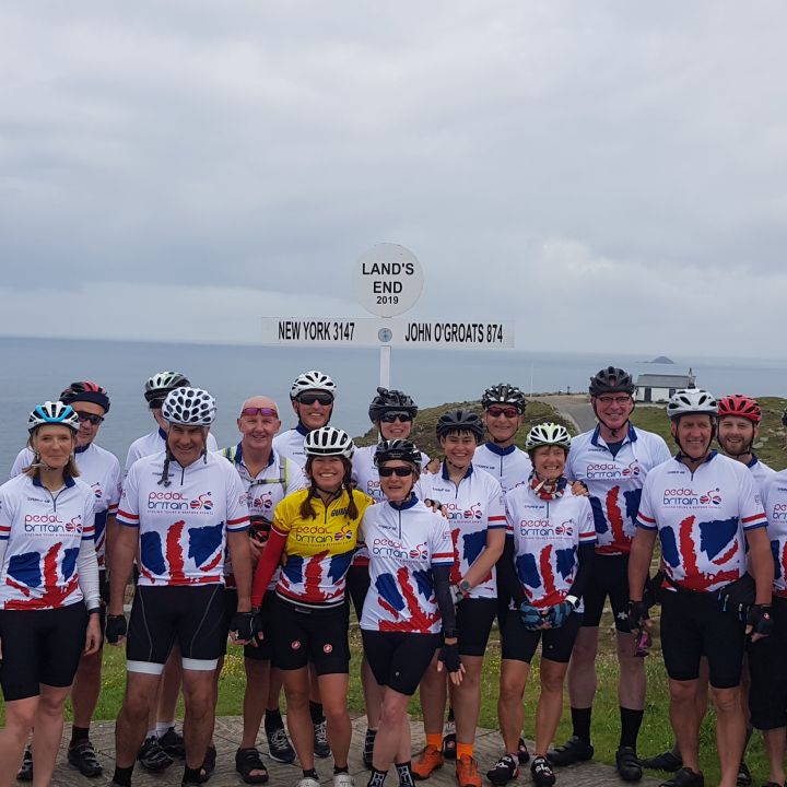 Group standing in front of Land's End sign