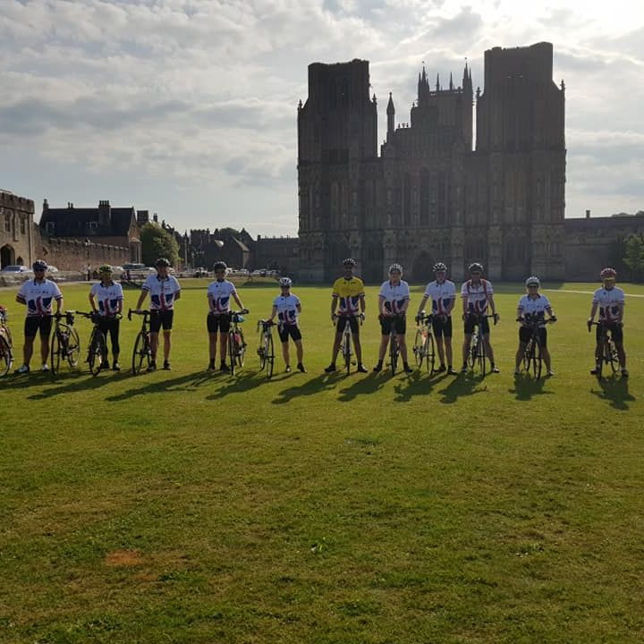 cyclists outside Wells Cathedral